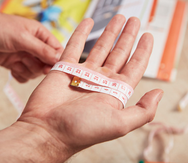 Measuring a hand to work out glove size