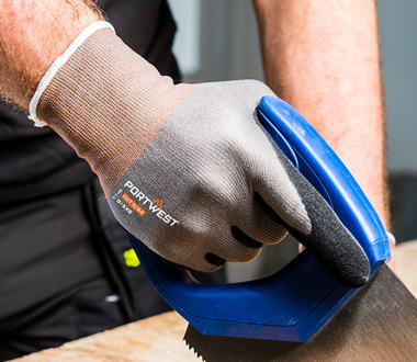 A correctly sized glove being worn while using a tool